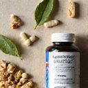 Flat lay composition with Men's Energy Vitamin Complex and natural ingredients